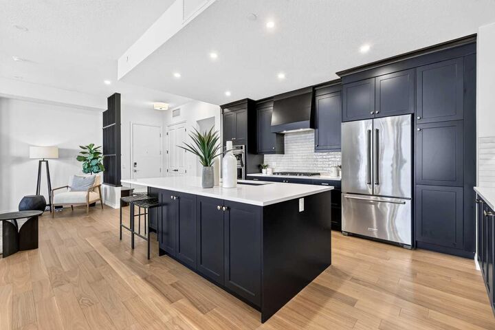Property Photo: 130 Marina Cove SE 301 AB T3M 3P4