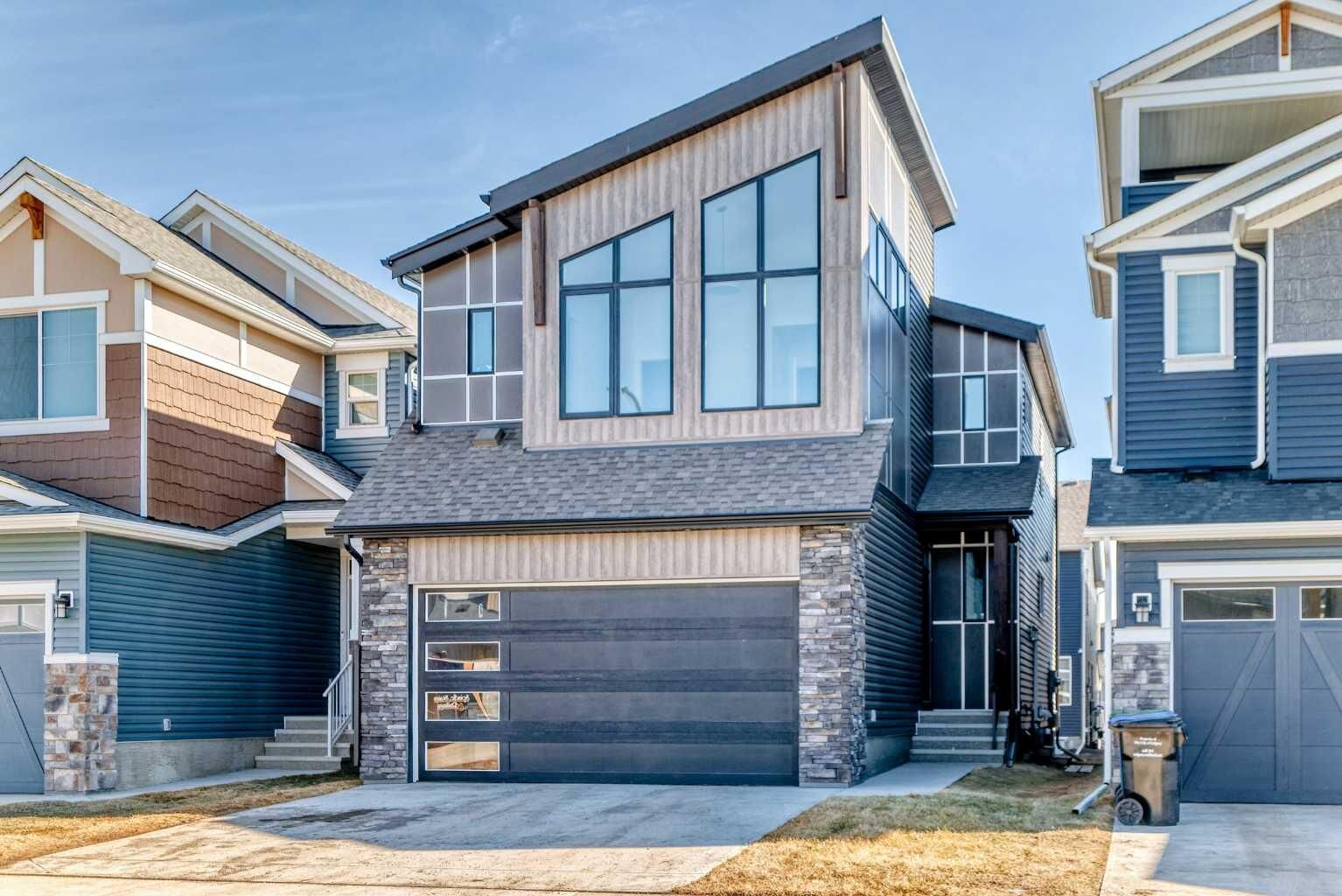 Property Photo: 138 Silver Spruce Grove SW AB T2X 5M2