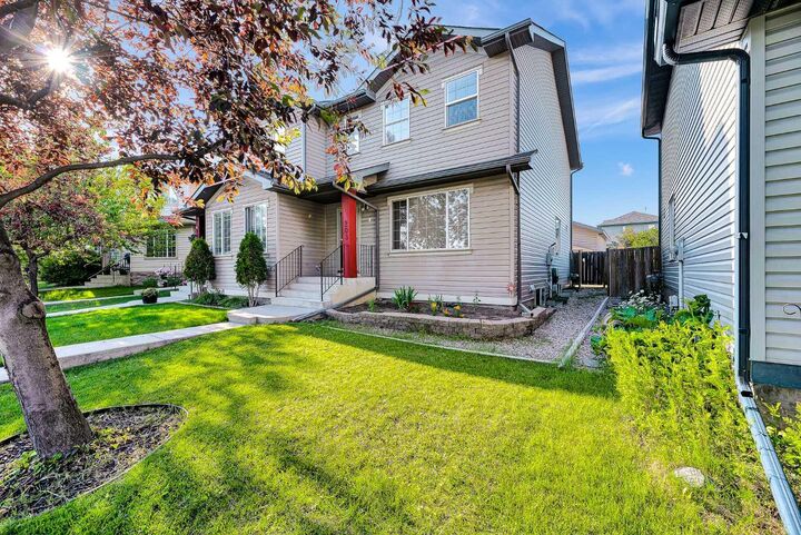 Property Photo: 203 Covemeadow Crescent AB T3K 6B1