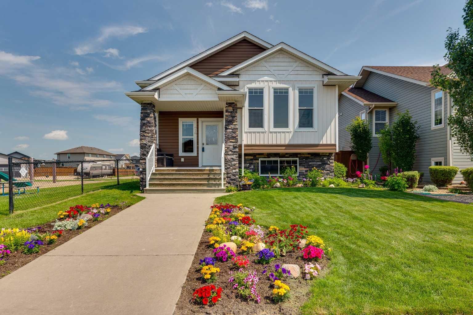 Property Photo:  74 Mackenzie Crescent  AB T4L 0B3 