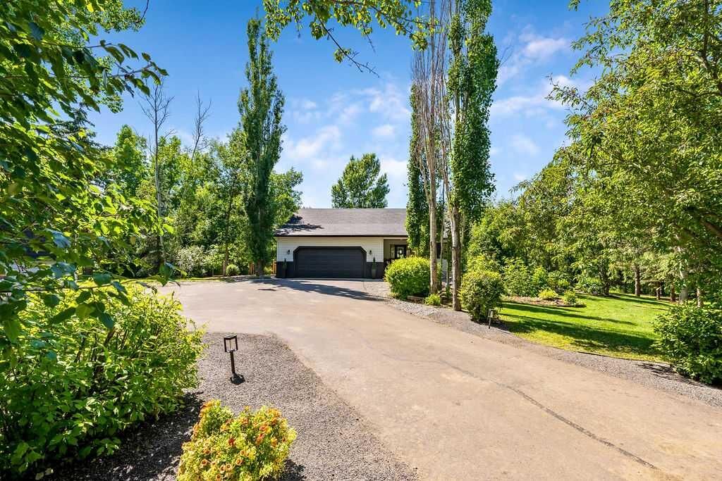 Property Photo: 80107 Highwood Meadows Drive E AB T1S 4Y9