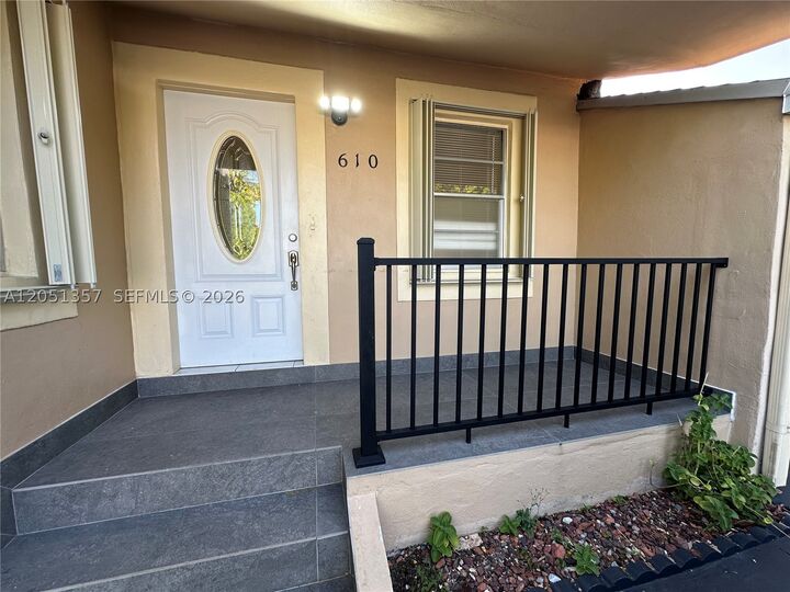 Property Photo:  610 NW 23rd Pl Front  FL 33125 
