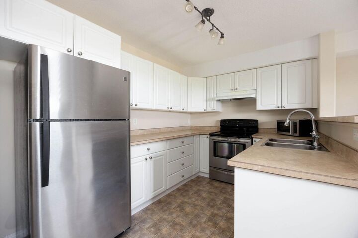 Property Photo:  248B Grosbeak Way 202  AB T9K 0V9 
