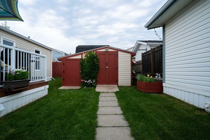 Property Photo: 107 Cree Lane AB T9K 1Y5