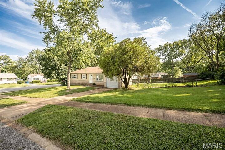Property Photo:  1115 Forestwood Drive  MO 63135 