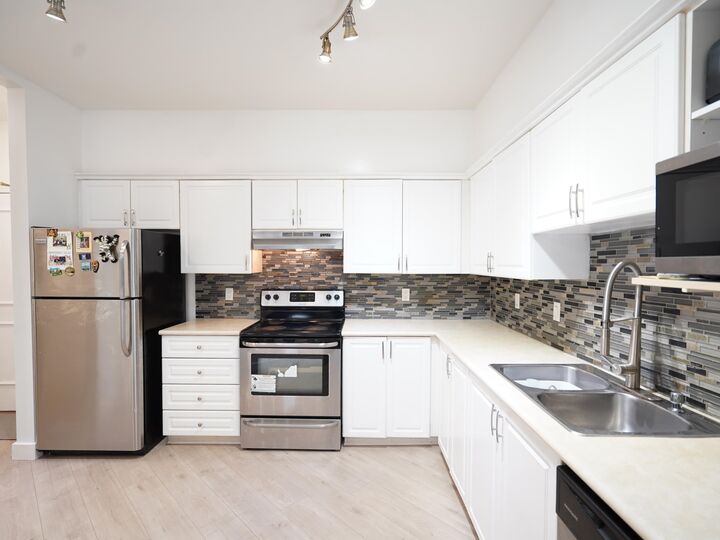 Property Photo: 8139 121A Street 115 BC V3W 0Z2