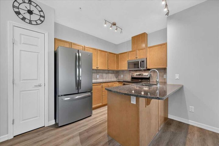 Property Photo:  92 Crystal Shores Road 4210  AB T1S 2N2 