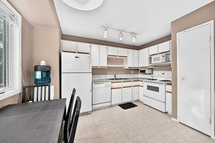 Property Photo: 123 Queensland Drive SE 13 AB T2J 3R3