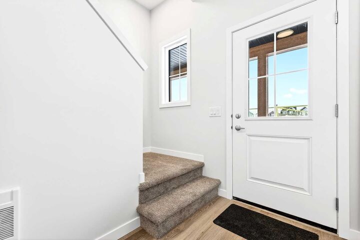 Property Photo: 40 Creekside Way SW 301 AB T2X 6E2