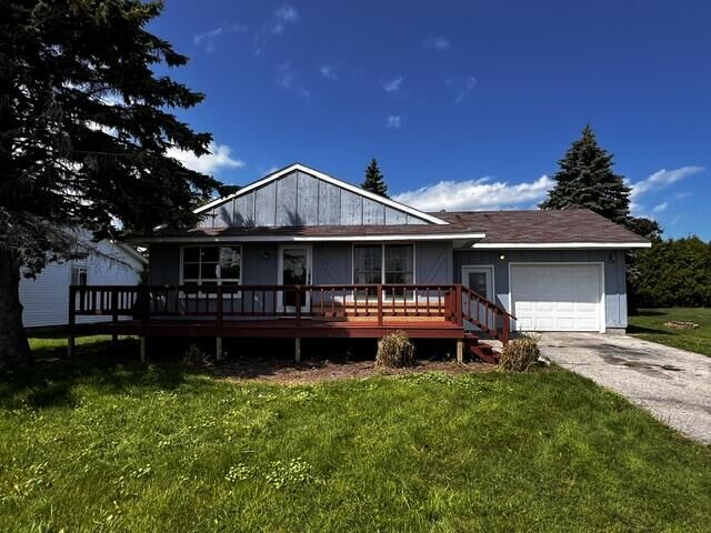 Property Photo:  116 Byron Street  MI 49721 