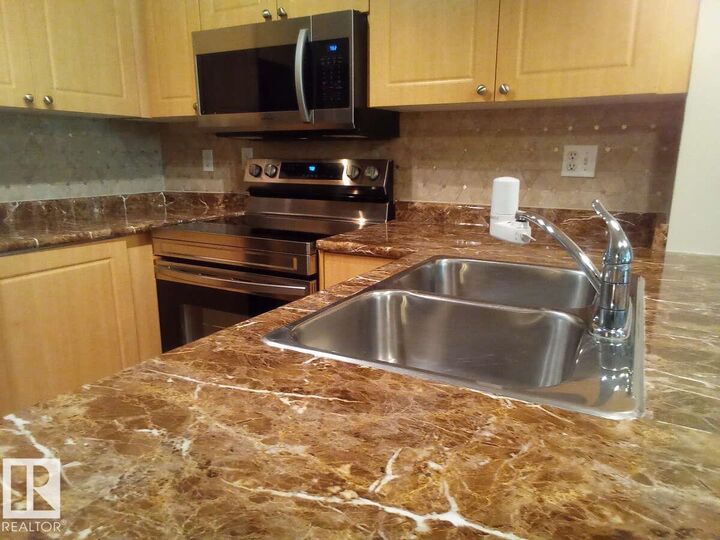 Property Photo: 616 McAllister Loop SW 113 AB T6W 1N1