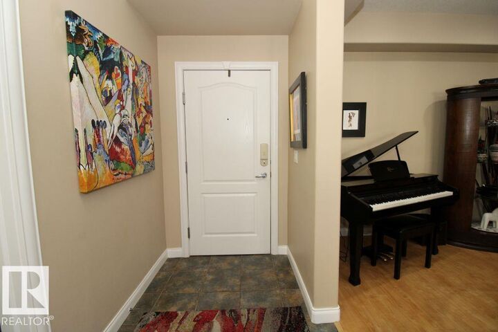 Property Photo: 1406 Hodgson Way NW 201 AB T6R 3K1