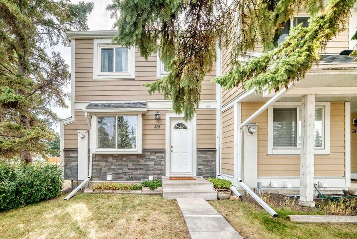 Property Photo:  315 Georgian Villas NE  AB T2A 7E1 