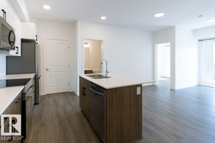 Property Photo: 9211 228 Street NW 206 AB T5T 4T1