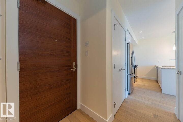 Property Photo: 11969 Jasper Avenue NW 401 AB T5K 0P1