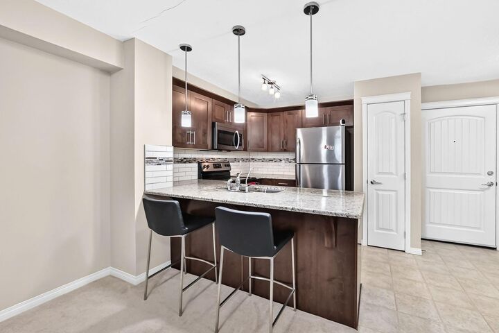 Property Photo:  130 Panatella Street NW 1110  AB T3K 0Y6 