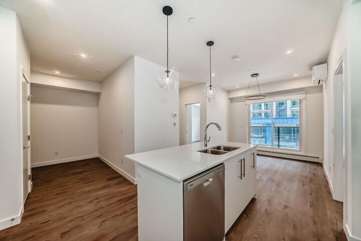 Property Photo: 8370 Broadcast Avenue SW 205 AB T3H 6L3