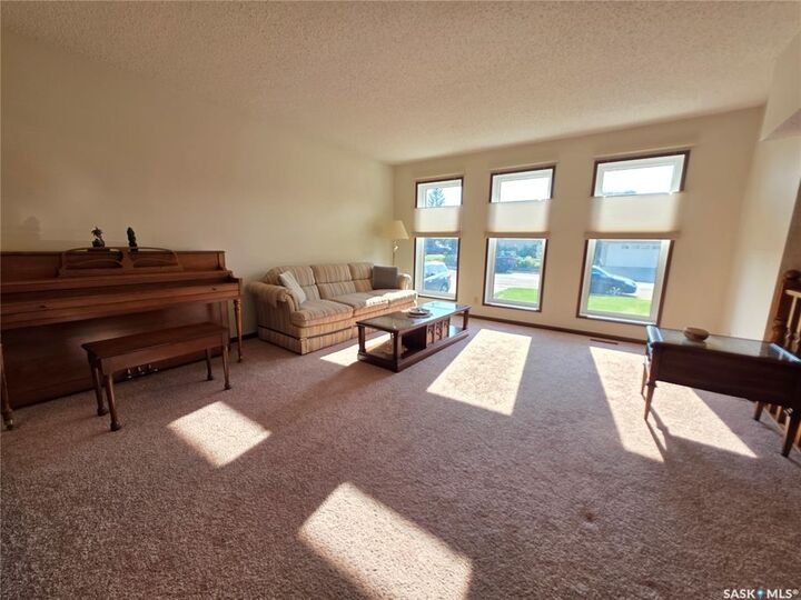 Property Photo:  411 Milburn Crescent  SK S9H 4X8 