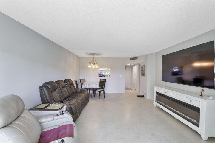 Property Photo:  3590 Via Poinciana 107  FL 33467 