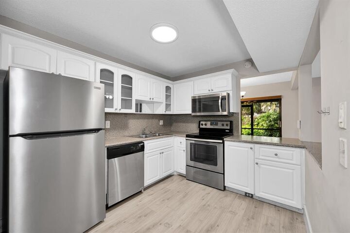 Property Photo:  1169 NW 13th Street #1  FL 33486 