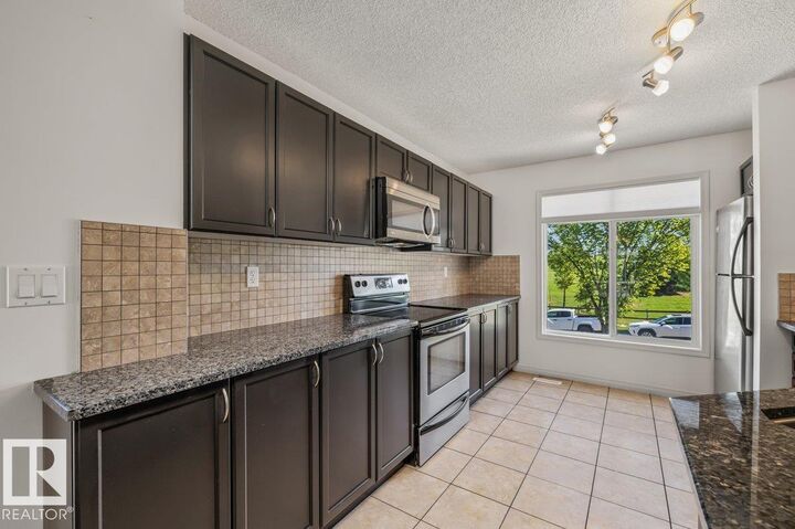Property Photo:  1804 70 Street SW 1  AB T6X 0H4 