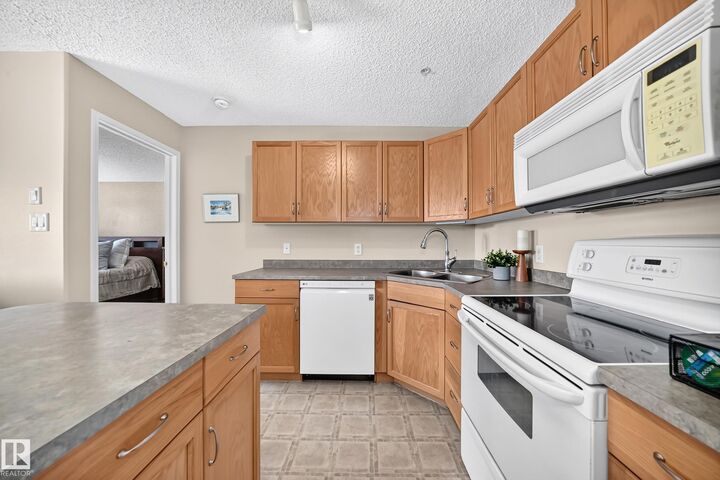 Property Photo: 16303 95 Street NW 204 AB T5Z 3V1