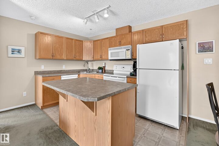 Property Photo: 16303 95 Street NW 204 AB T5Z 3V1