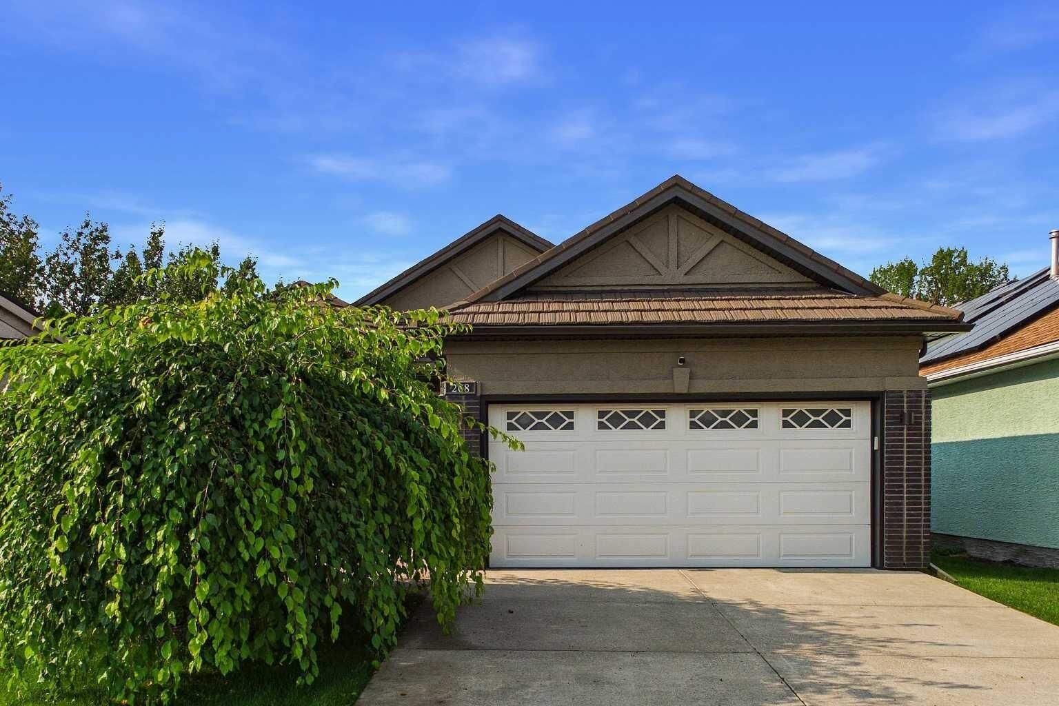 Property Photo: 208 Harvest Lake Green NE AB T3K 4K9