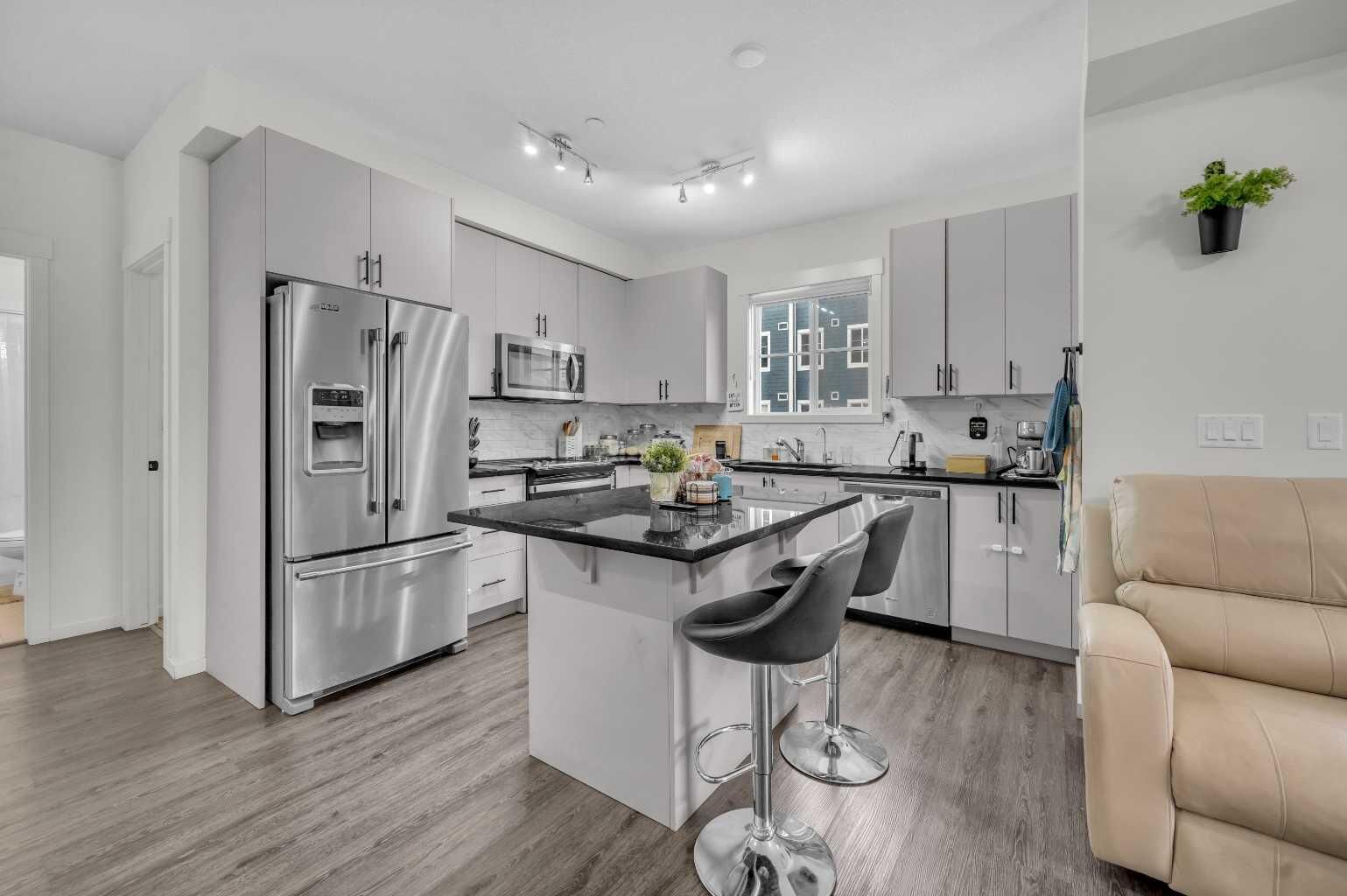 Property Photo:  151 Legacy Main Street SE 8218  AB T2X 5C7 