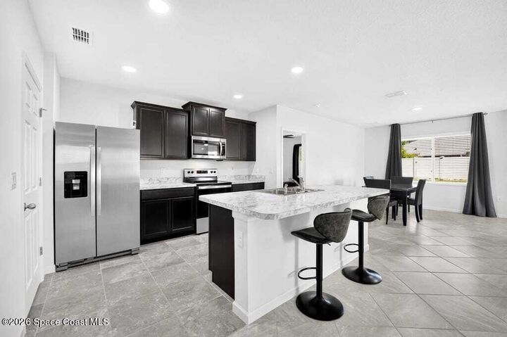 Property Photo:  211 Guinevere Drive SW  FL 32908 