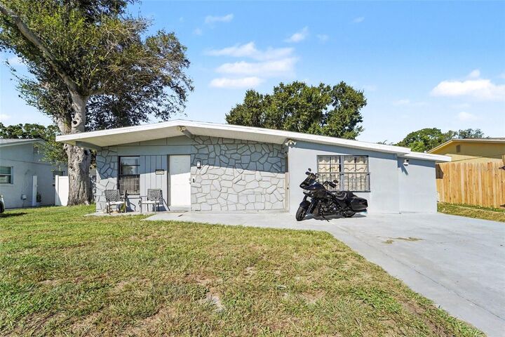 Property Photo:  4834 Alvarado Drive  FL 33634 