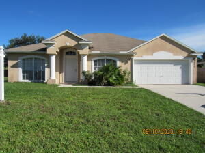 Property Photo: 932 SW McElroy Avenue FL 34953
