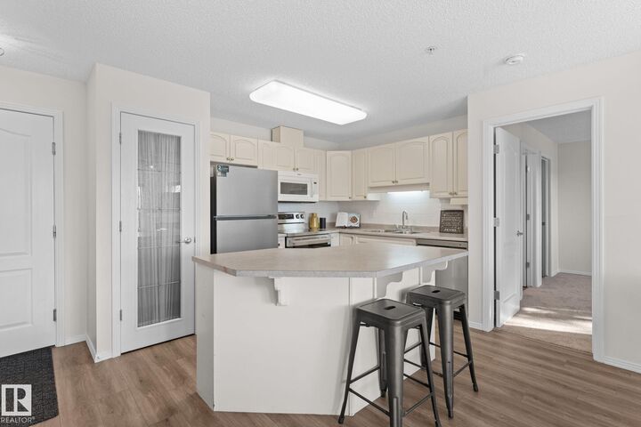 Property Photo:  2420 108 Street NW 207  AB T6J 7J3 