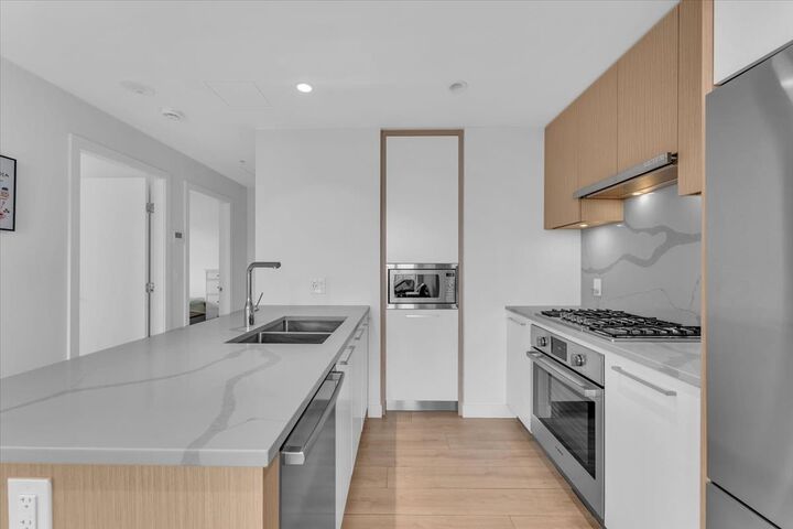 Property Photo: 567 Clarke Road 3305 BC V3J 0K7