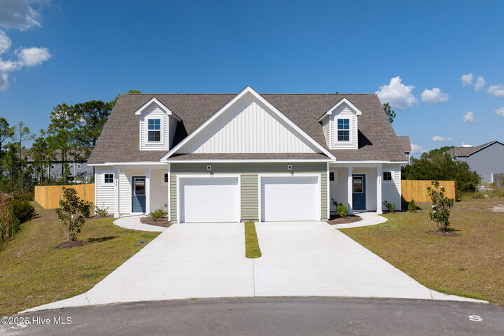 Property Photo:  303 Coastal Reef Court  NC 28445 