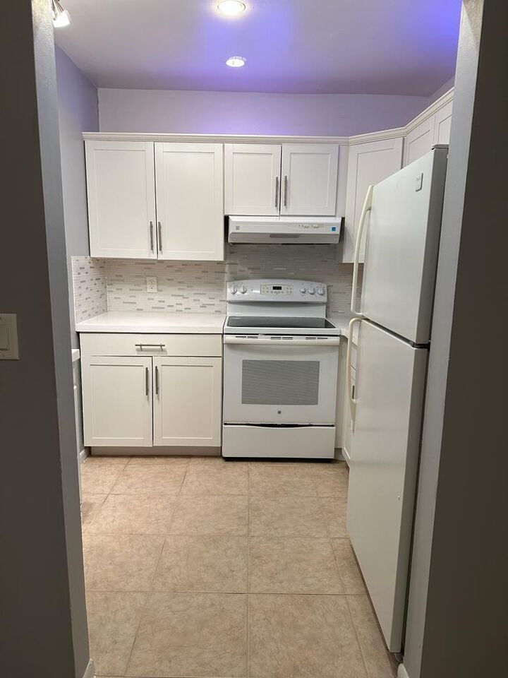 Property Photo:  83 Easthampton D  FL 33417 