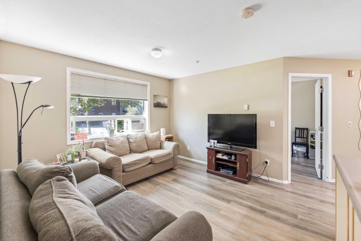 Property Photo:  180 Kananaskis Way 117  AB T1W 3C6 