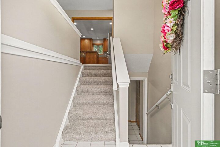 Property Photo: 7830 Raven Oaks Drive NE 68152