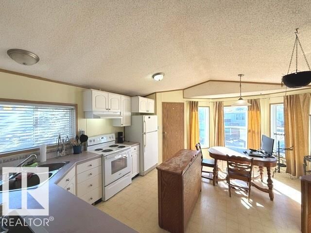 Property Photo:  1234 Lake Vista Crescent  AB T8H 1K5 