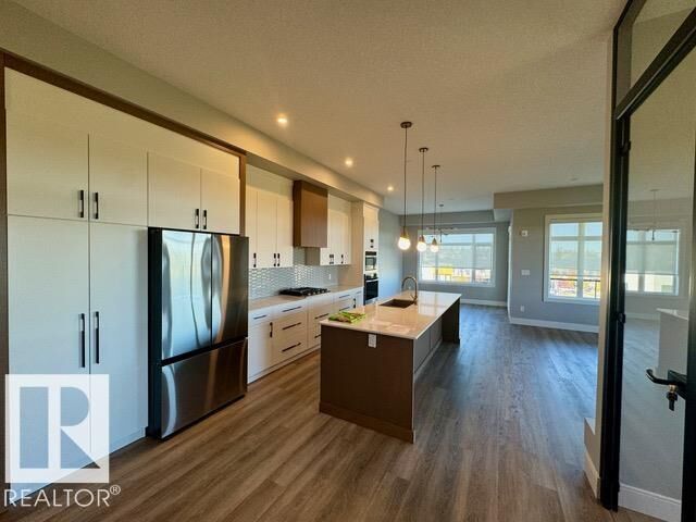 Property Photo: 7471 May Common NW 410 AB T6R 0X5