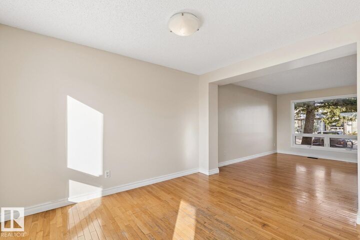 Property Photo:  14713 25 Street NW  AB T5Y 2E8 