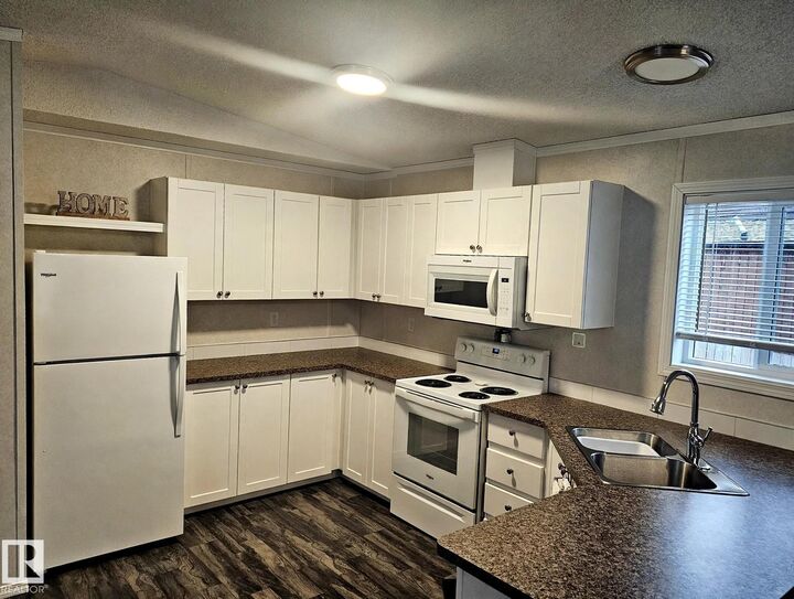 Property Photo:  12604 153 Avenue NW 8  AB T5X 4M7 