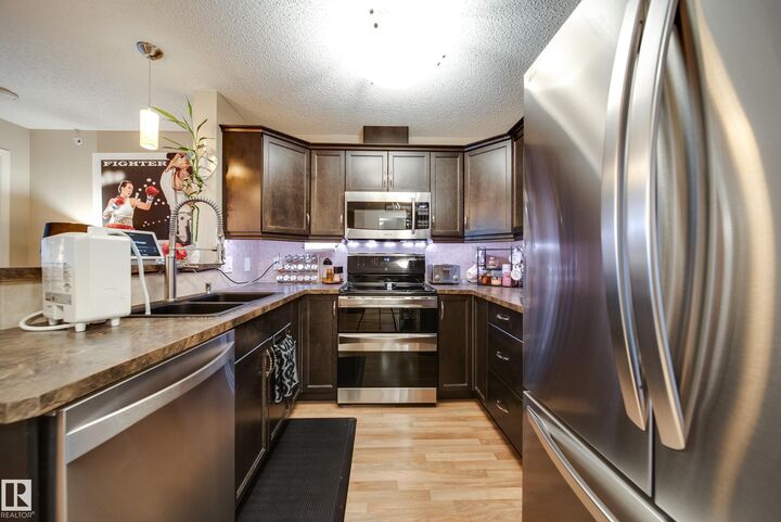 Property Photo: 2436 Guardian Road NW 443 AB T5T 2P5
