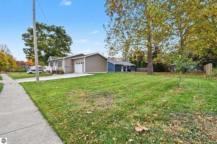 Property Photo: 106 E Saint Andrews Drive MI 48640